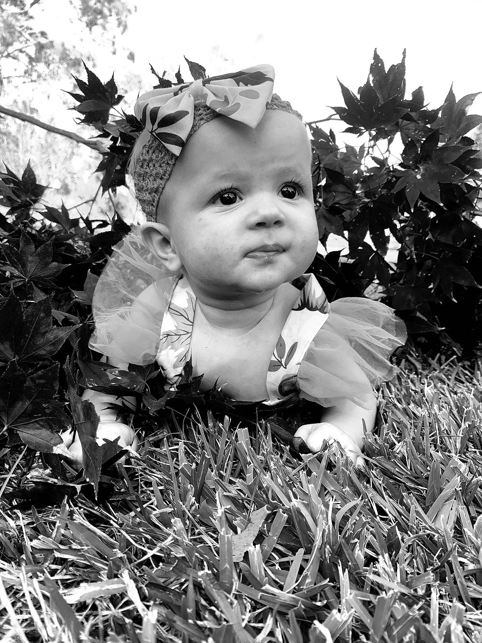 Zoey is registered to the contest to win money with this photo: adaptation, baby, black_and_white, botany, child, flash_photography, grass, happy, headpiece, iris, leaf, monochrome, monochrome_photography, nature, people_in_nature, person, plant, sky, standing, style