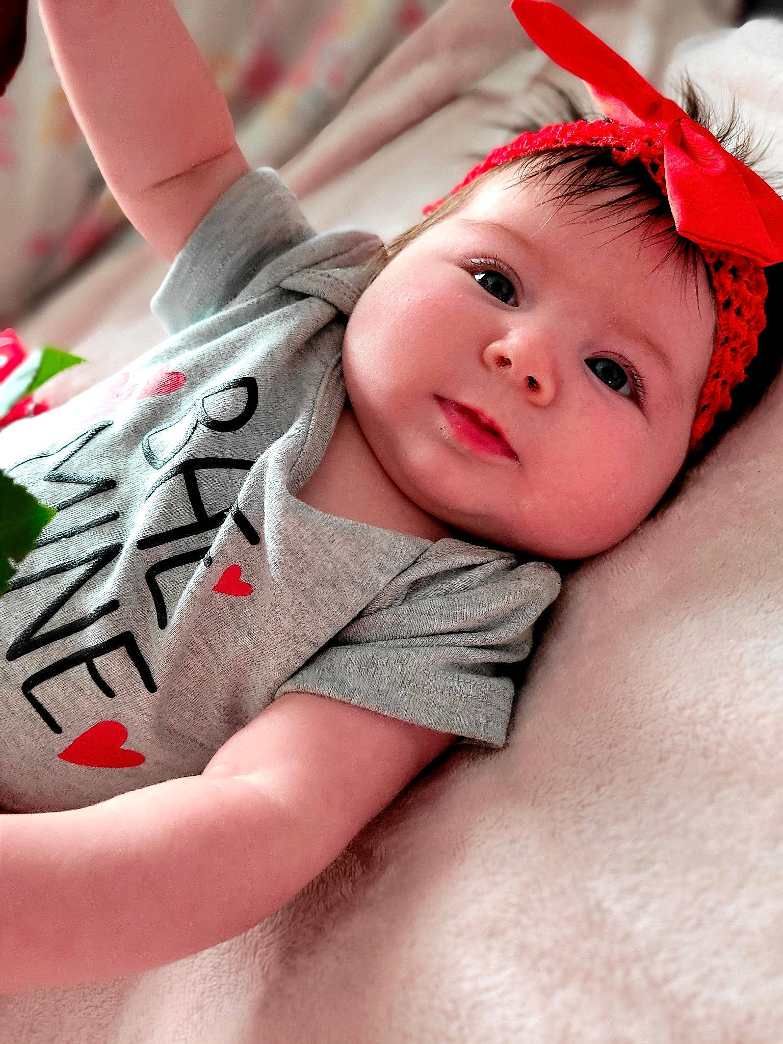 Taylynn joined the competition — help win amazing prizes! baby, baby_toddler_clothing, cheek, child, close_up, comfort, eye, eyelash, finger, fun, gesture, grass, hand, happy, headwear, human_leg, lip, person, pink, skin