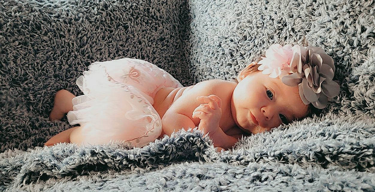 Taylynn joined the competition — help win amazing prizes! baby, beauty, blond, child, close_up, doll, eyelash, fawn, fur, grass, hair_accessory, headgear, headpiece, headwear, jewellery, linens, lip, person, pink, skin