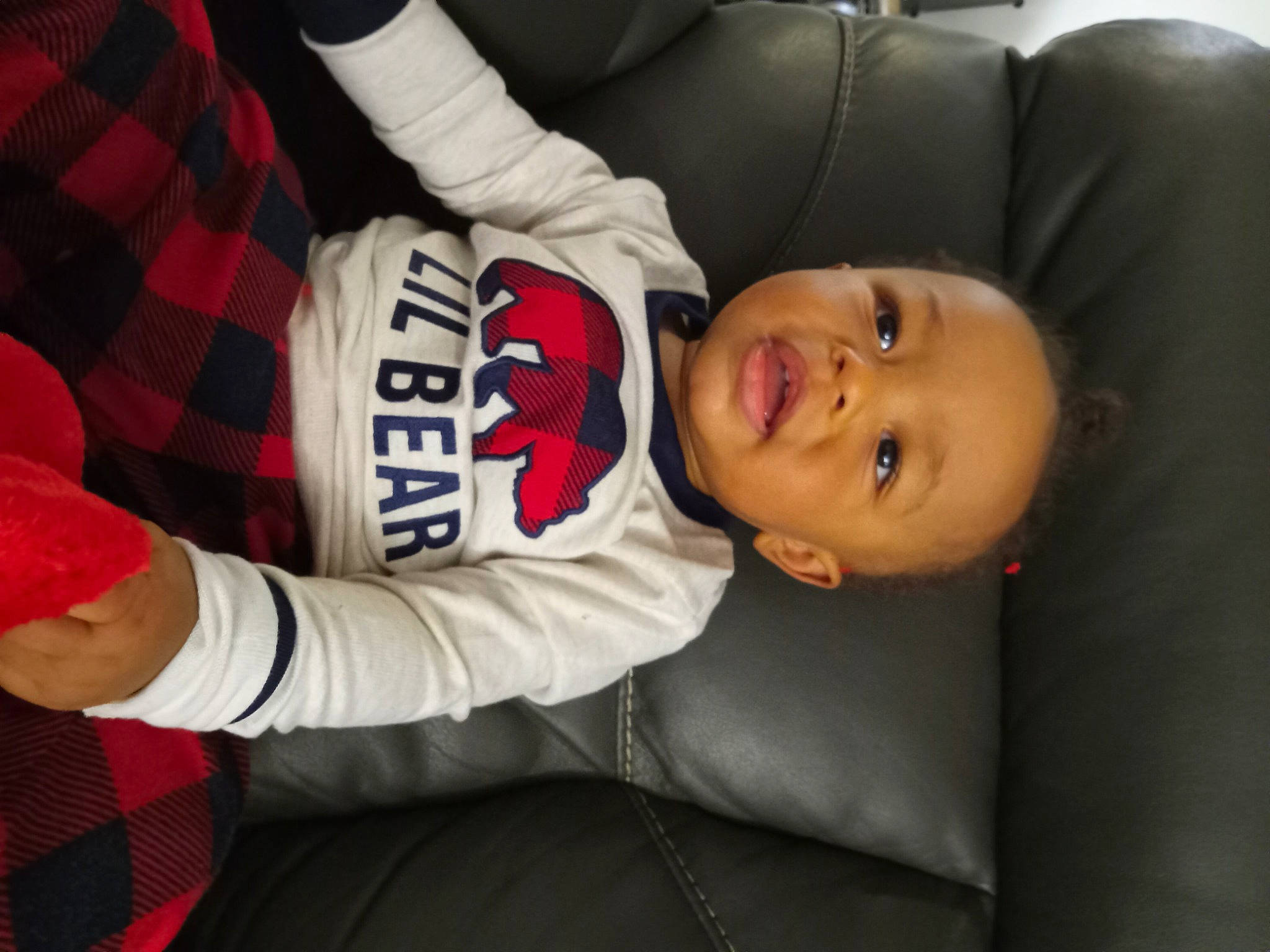 Legacy Elohim is registered to the contest to win money with this photo: baby, baby_toddler_clothing, carmine, child, comfort, elbow, human_body, knee, pattern, person, plaid, sitting, sleeve, sportswear, tartan, toddler