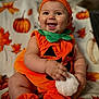 Nylann participe au concours pour gagner de l'argent avec cette photo : autumn, baby, child, chubby_arms, costume, cozy, cute, face, festive, happy, headband, holiday, indoors, leaves, orange, plush_toy, pumpkin_costume, seasonal, sitting, smiling