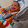 Jakaiven joined the competition — help win amazing prizes! baby, child, smiling, happy, infant, portrait, bouncer, baby_seat, orange_clothing, toy, colorful_toy, indoor, home, nursery, sitting,  안전, face, grinning, playtime, blanket
