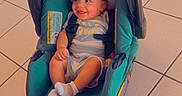 Jakaiven is registered to the contest to win money with this photo: baby, child, infant, smiling, happy, car_seat, stroller, seated, indoors, tiled_floor, portrait, casual, clothing, striped_outfit, socks, safety_harness, teal, backrest, timestamp, heart_emoji