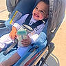Jakaiven joined the competition — help win amazing prizes! baby, child, infant, smiling, happy, stroller, bottle, feeding, outdoor, sunlight, portrait, face, eyes, hands, clothing, harness, seated, pavement, sidewalk, photography