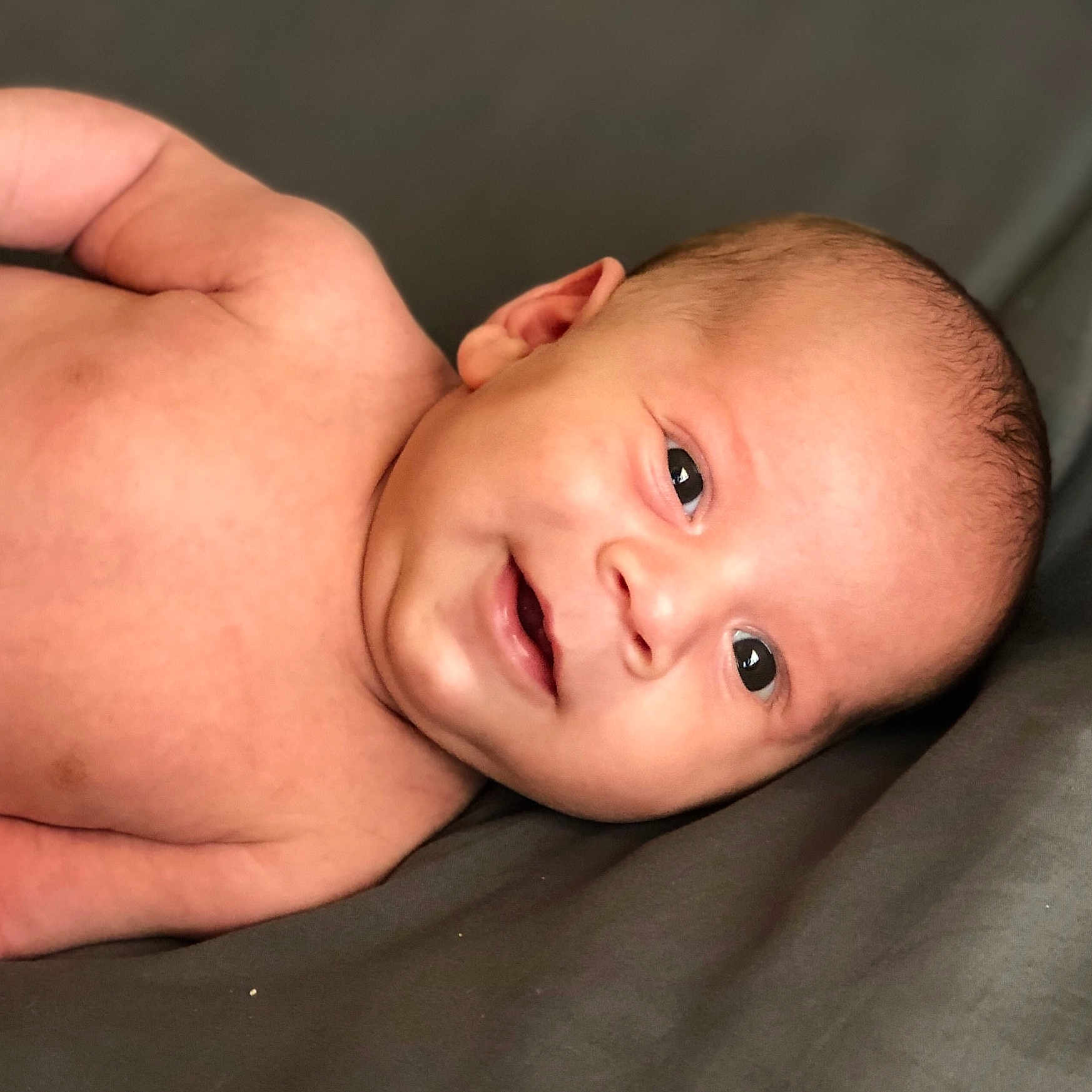 Ernesto is registered to the contest to win money with this photo: boy, cheek, child, chin, close_up, ear, eye, face, finger, forehead, hand, head, infant, lip, mouth, nose, skin, smile, toddler