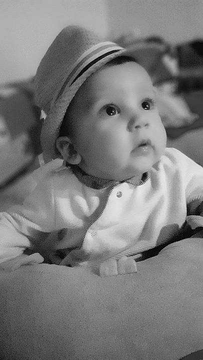 Stayce participe au concours pour gagner de l'argent avec cette photo : baby, baby_toddler_clothing, cap, cheek, child, comfort, flash_photography, fun, fur, happy, hat, headgear, headwear, human_body, iris, lip, monochrome, monochrome_photography, nose, person