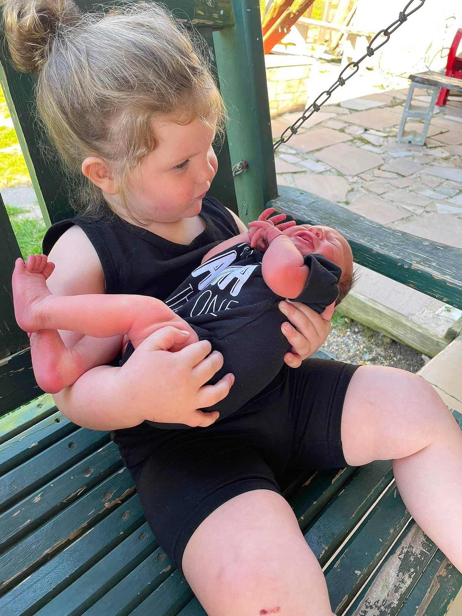 Tinsley Asta is registered to the contest to win money with this photo: baby_toddler_clothing, ball, finger, foot, fun, grass, hand, happy, human_leg, knee, lap, leg, leisure, muscle, person, shorts, sitting, summer, thigh, thumb