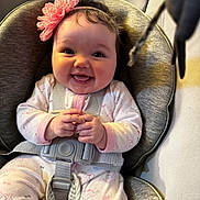 Ember is registered to the contest to win money with this photo: baby, buckle, car_seat, chubby_cheeks, closeup, eyes, fabric, flower, hair, hands, happy, harness, headband, infant, onesie, padding, playful, portrait, seat_cushion, smile