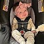 Ember joined the competition — help win amazing prizes! baby, headband, car_seat, smile, infant, clothing, socks, striped_pants, seatbelt, cute, child, indoors, sitting, happy, face, person, safety, accessory, toy, comfort