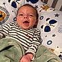 Augustin a rejoint le concours — aidez-le/la à gagner de superbes lots ! baby, infant, smiling, striped_shirt, blanket, pillow, animal_print, giraffe, bear, crib, cute, happy, indoors, child, portrait, hand, face, apparel, comfort, sleeping_area