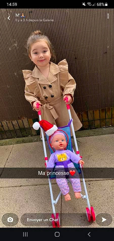 Stella participe au concours pour gagner de l'argent avec cette photo : baby, baby_carriage, baby_products, baby_safety, baby_toddler_clothing, baby_toys, child, costume, fun, joy, leisure, person, photograph, pink, play, sitting, smile, tire, toddler, wheel