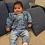 baby, carpet, child, cozy, cushion, cute, denim_jacket, denim_overalls, feet, furniture, hand, indoors, living_room, pillow, portrait, sitting, smile, socks, sofa, window