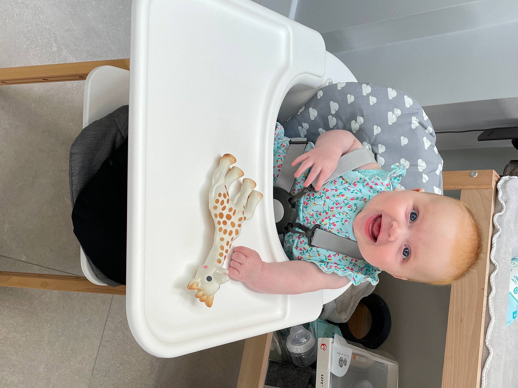 Ellie is registered to the contest to win money with this photo: baby, baby_laughing, baby_products, baby_safety, baby_toddler_clothing, baby_toys, chair, child, comfort, fun, hat, pattern, person, room, smile, sock, toddler