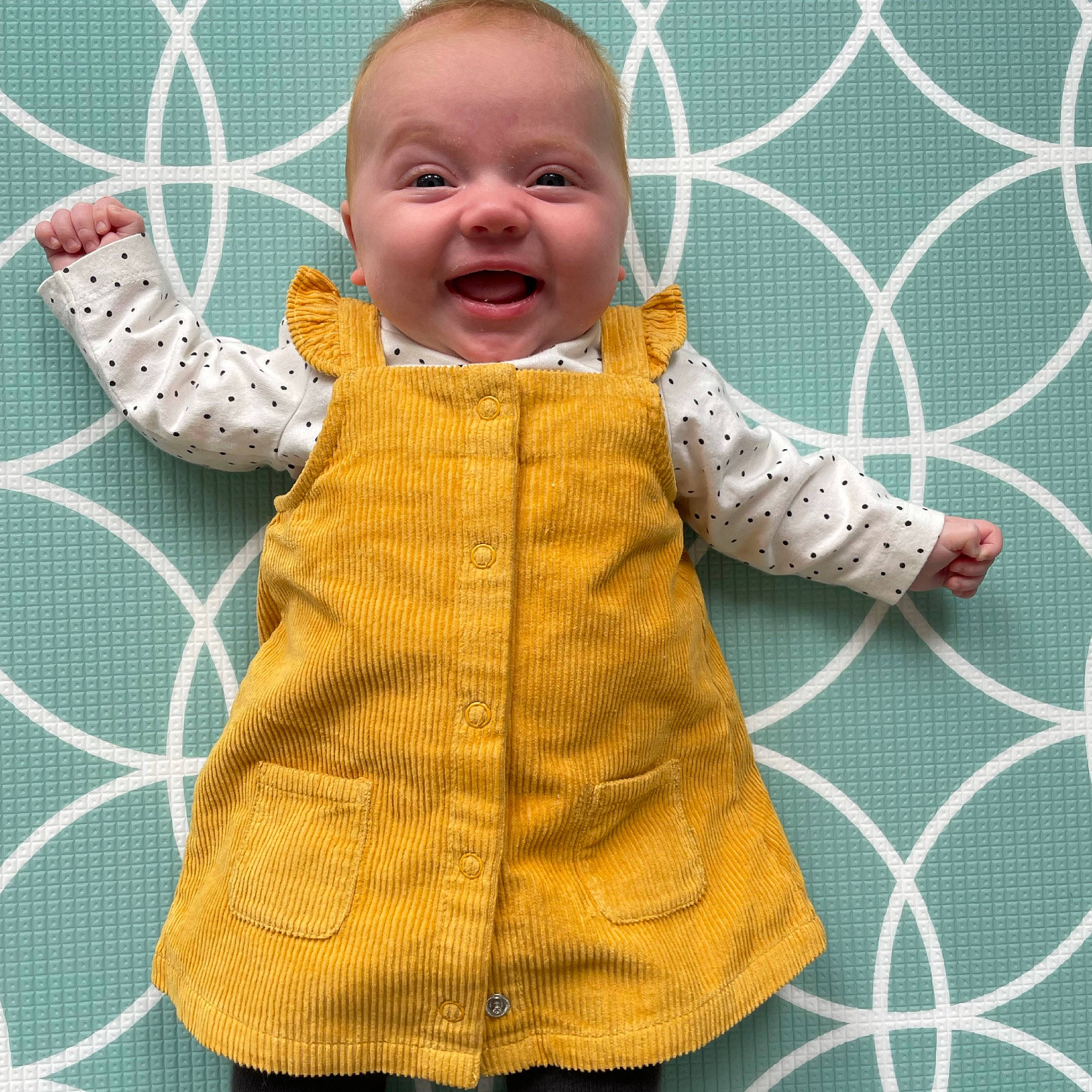 Ellie joined the competition — help win amazing prizes! baby, baby_products, baby_toddler_clothing, child, dress, eye, face, fence, happy, head, linens, mesh, organ, outerwear, pattern, person, skin, sleeve, smile, textile