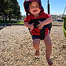 Daisy joined the competition — help win amazing prizes! toddler, child, swing, playground, hat, red_shirt, shorts, smiling, happy, outdoor, sunny, daylight, trees, wood_chips, park, blue_sky, person, summer, vacation, fun