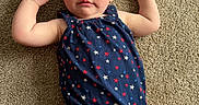 Daisy joined the competition — help win amazing prizes! baby, child, infant, carpet, blue_outfit, stars, headband, bow, red, white, blue, arms, legs, skin, face, expression, indoor, floor, person, cute