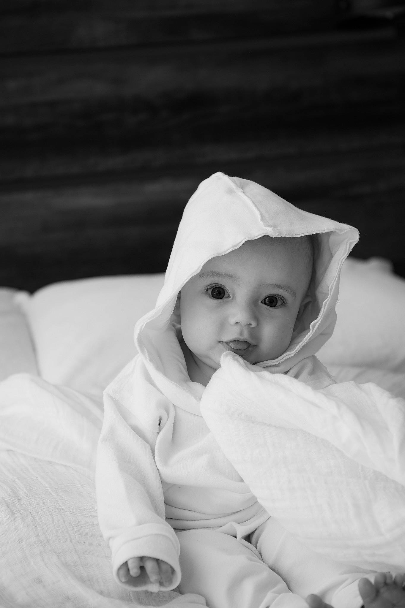 Brody is registered to the contest to win money with this photo: baby, black_and_white, cheek, child, comfort, eye, eyebrow, flash_photography, fur, grass, happy, headgear, headwear, lip, monochrome, monochrome_photography, person, sitting, skin, sleeve