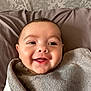 Isaac is registered to the contest to win money with this photo: baby, smiling, face, towel, blanket, portrait, child, happy, infant, cute, skin, head, eyes, mouth, indoors, person, expression, cozy, wrapped, young