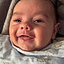 Isaac is registered to the contest to win money with this photo: baby, smiling, face, blanket, bunny_prints, cozy, cute, infant, child, soft_texture, happy, resting, closeup, portrait, wearing, clothing, skin, head, eyes, mouth
