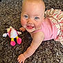 baby, blue_eyes, carpet, child, chubby_cheeks, crawling, cute, eyes, hand, happy, indoor, infant, pink_outfit, plush_toy, portrait, rosy_cheeks, ruffled_skirt, shag_rug, smiling, toy
