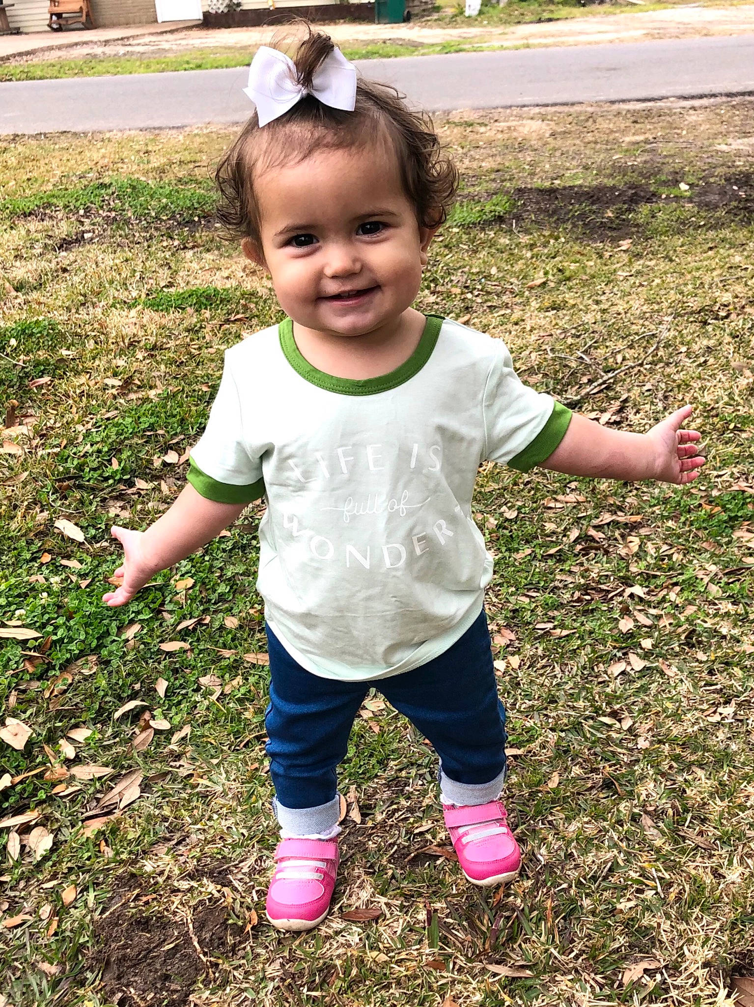 Juliette is registered to the contest to win money with this photo: active_pants, baby, baby_toddler_clothing, child, grass, hair_accessory, happy, headband, joy, person, sock, toddler, walking_shoe