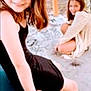 child, girl, smile, outdoor, playground, crouching, sitting, dress, black_dress, light_dress, hair, happy, concrete, daylight, fun, friends, casual, young, people, portrait