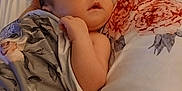 Leah is registered to the contest to win money with this photo: baby, sleeping, blanket, floral_pattern, pacifier, plush_toy, giraffe, bed, cozy, infant, child, soft_lighting, rest, cute, closeup, portrait, peaceful, indoors, comfort, wrapped