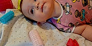 Leah joined the competition — help win amazing prizes! accessories, baby, blanket, child, colorful, curious_expression, cute, dog_print, face, flower_clip, hair_rollers, indoor, infant, lying_down, person, pink_onesie, playful, portrait, red_bow, soft_fabric