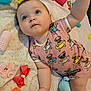 Leah is registered to the contest to win money with this photo: baby, blanket, blue_eyes, child, curlers, cute, face, hand, indoor, infant, lying_down, onesie, playful, pug_pattern, red_bow, skin, small_hand, sock, soft_toy, toy