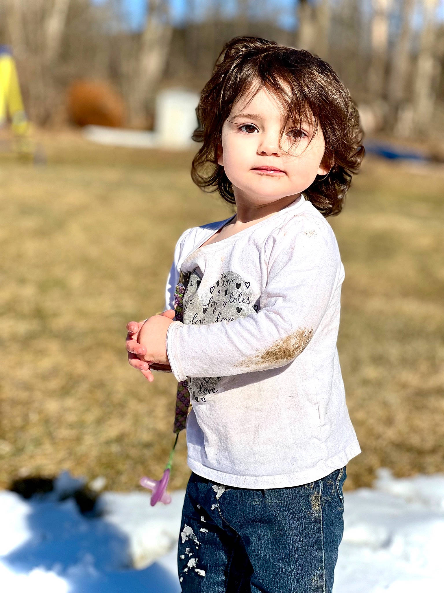 Caylee is registered to the contest to win money with this photo: blond, brown_hair, child, eye, face, flash_photography, freezing, fun, grass, hair, happy, leisure, people_in_nature, person, recreation, sitting, sleeve, street_fashion, t_shirt, toddler