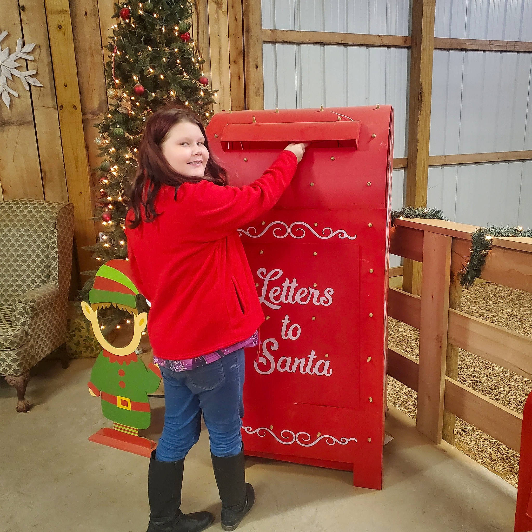 Kaylee is registered to the contest to win money with this photo: christmas, christmas_decoration, christmas_ornament, christmas_tree, conifer, event, flooring, fun, handwriting, happy, holiday, holiday_ornament, interior_design, joy, mammal, ornament, pattern, person, red, room