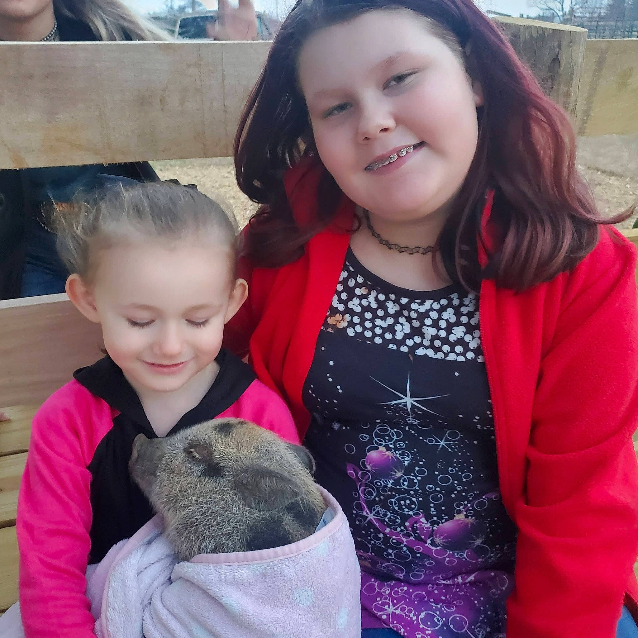 Kaylee joined the competition — help win amazing prizes! baby, child, event, fashion_accessory, friendship, fun, fur, happy, iris, joy, leisure, outerwear, pattern, person, recreation, sitting, skin, sleeve, smile, t_shirt