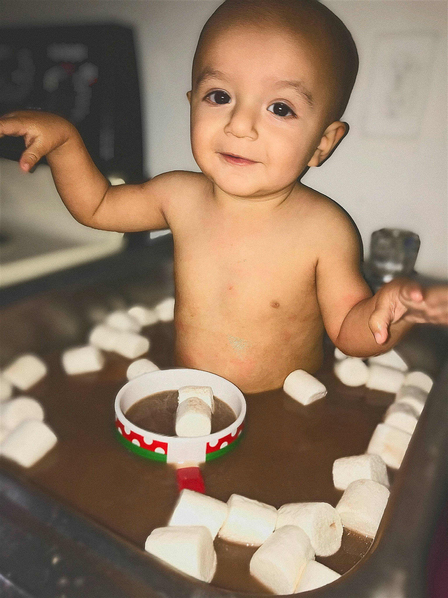 Axl is registered to the contest to win money with this photo: abdomen, baby, baby_bathing, baby_toddler_clothing, barechested, cheek, chest, child, cup, finger, hand, marshmallow, muscle, person, stomach, thumb, toddler, trunk