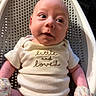 Nova is registered to the contest to win money with this photo: baby, infant, onesie, mittens, seat, perforated, face, skin, expression, clothing, newborn, cute, portrait, indoor, human, child, sitting, looking, apparel, adorable