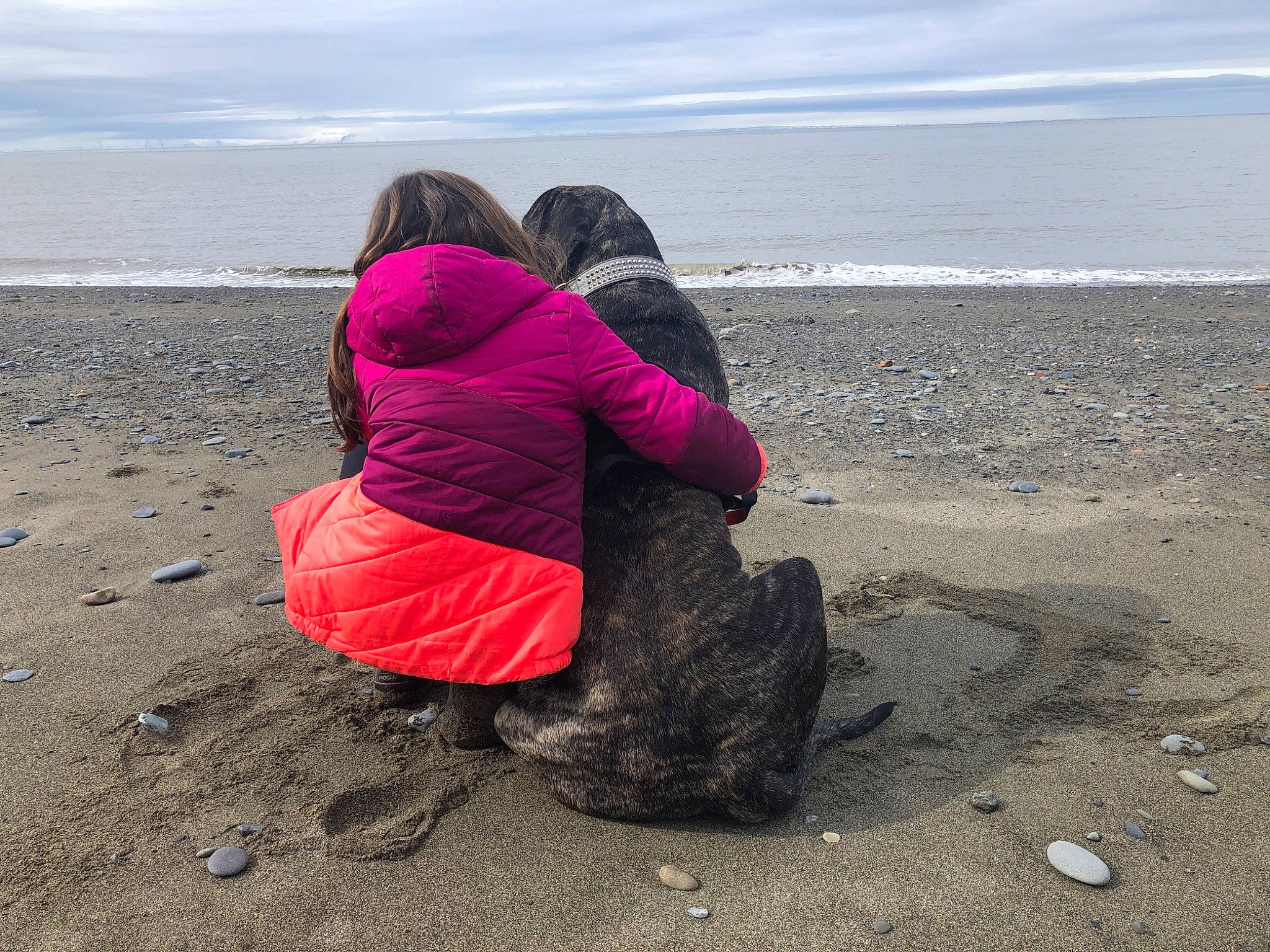 Diesel is registered to the contest to win money with this photo: beach, cloud, coastal_and_oceanic_landforms, fun, happy, horizon, jacket, landscape, leisure, magenta, people_in_nature, rock, sand, sitting, sky, travel, water, wave, wind_wave, wood