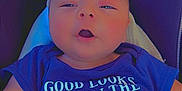 Joe Michale Segura joined the competition — help win amazing prizes! baby, infant, car_seat, blue_clothing, toy, blanket, face, hands, child, cute, indoor, expression, closeup, sitting, comfort, apparel, person, skin, newborn, head