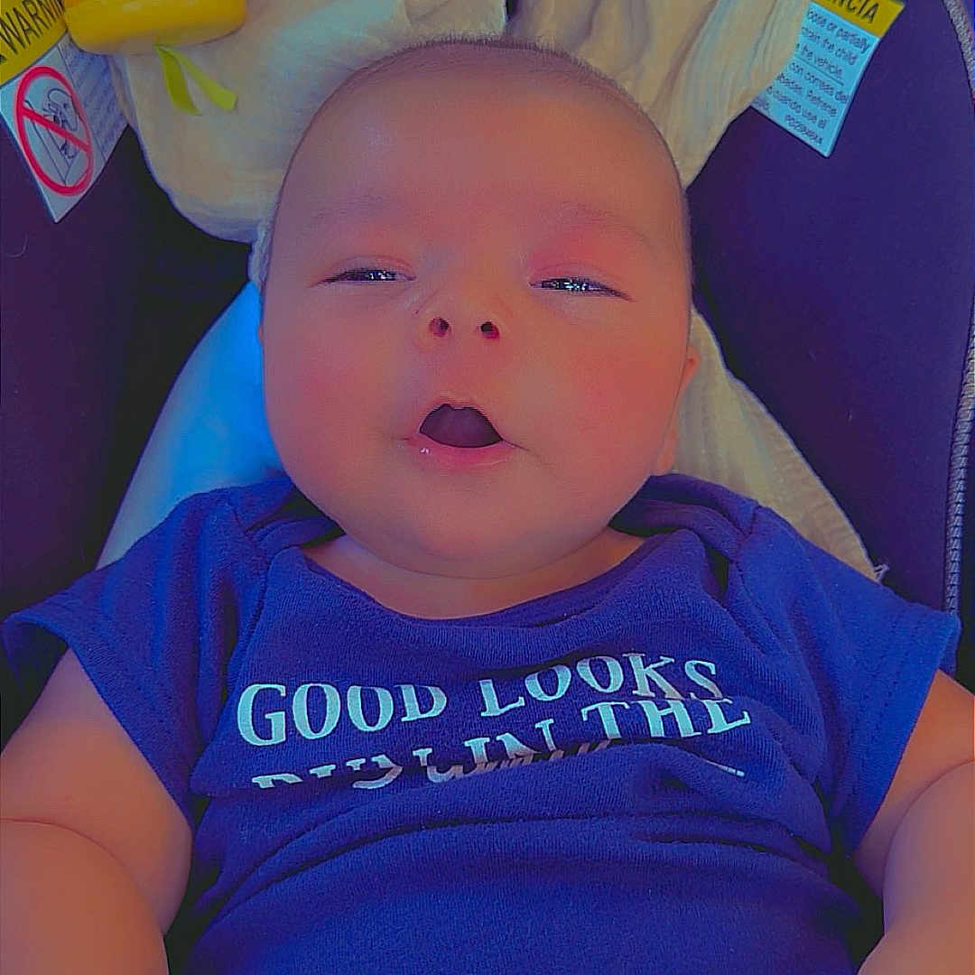Joe Michale Segura joined the competition — help win amazing prizes! apparel, baby, blanket, blue_clothing, car_seat, child, closeup, comfort, cute, expression, face, hands, head, indoor, infant, newborn, person, sitting, skin, toy
