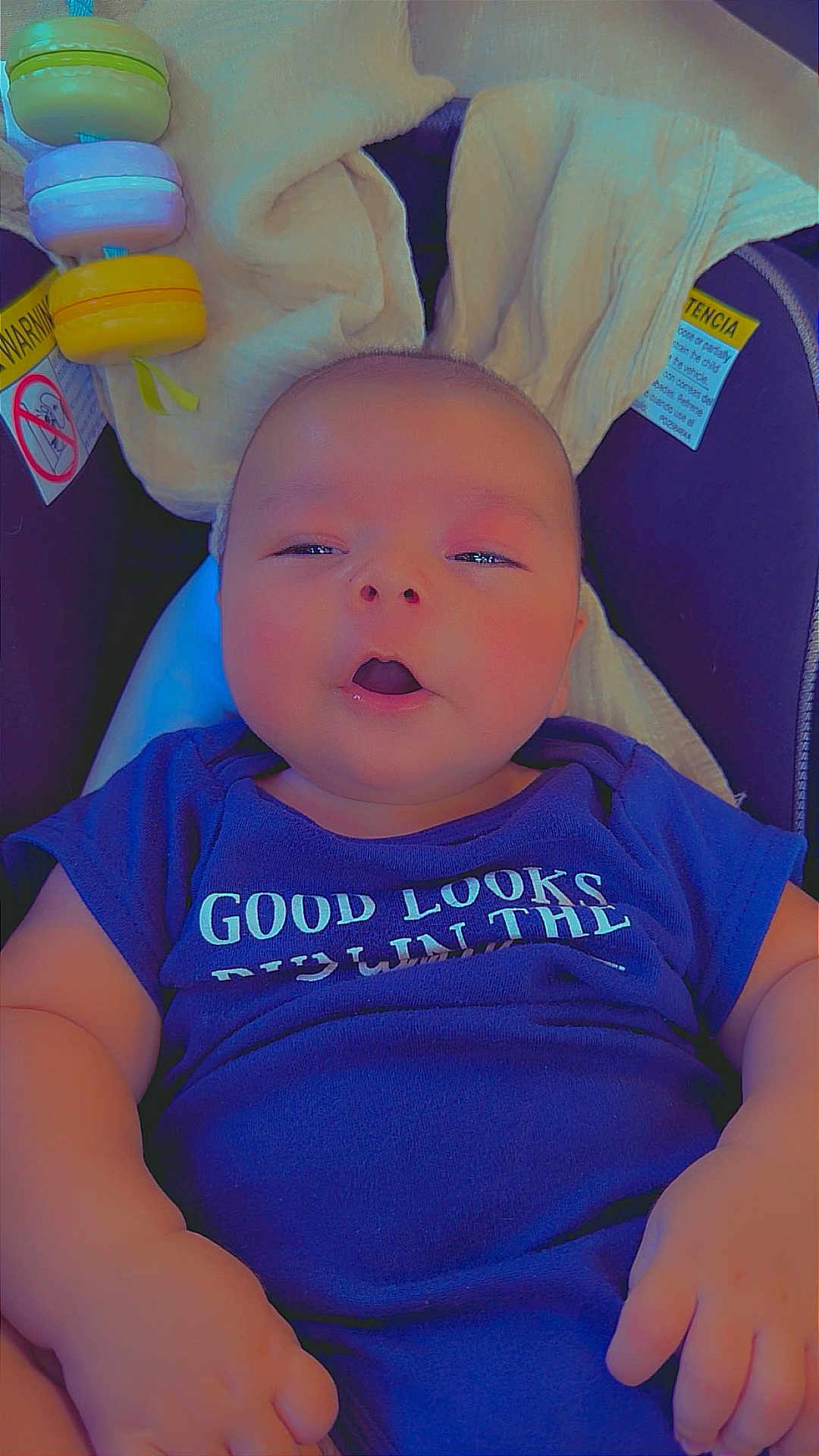 Joe Michale Segura joined the competition — help win amazing prizes! baby, infant, car_seat, blue_clothing, toy, blanket, face, hands, child, cute, indoor, expression, closeup, sitting, comfort, apparel, person, skin, newborn, head