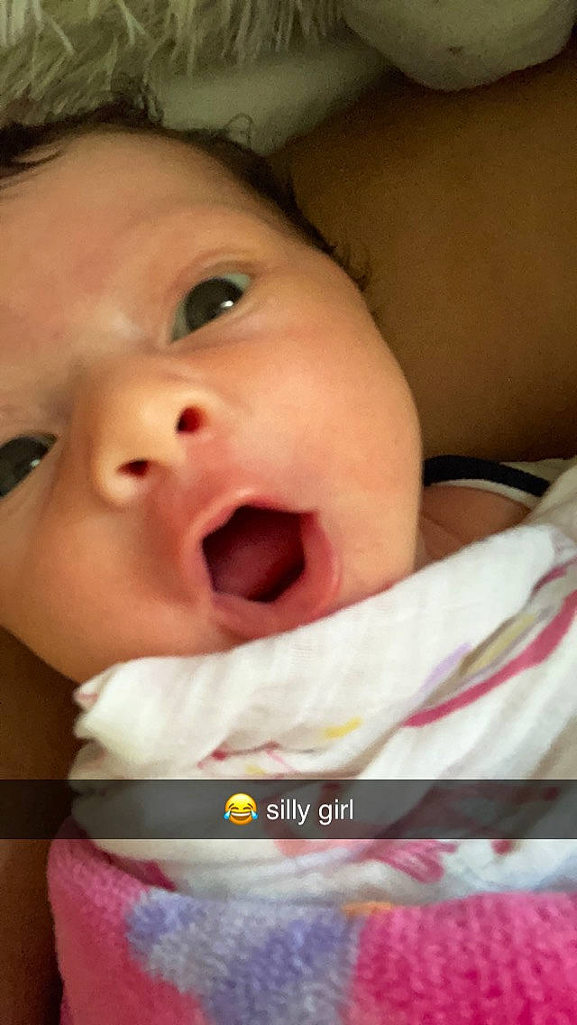 Callie is registered to the contest to win money with this photo: baby, baby_toddler_clothing, cheek, chin, eyebrow, eyelash, finger, forehead, fun, happy, iris, jaw, lip, mouth, neck, nose, person, pink, skin, smile