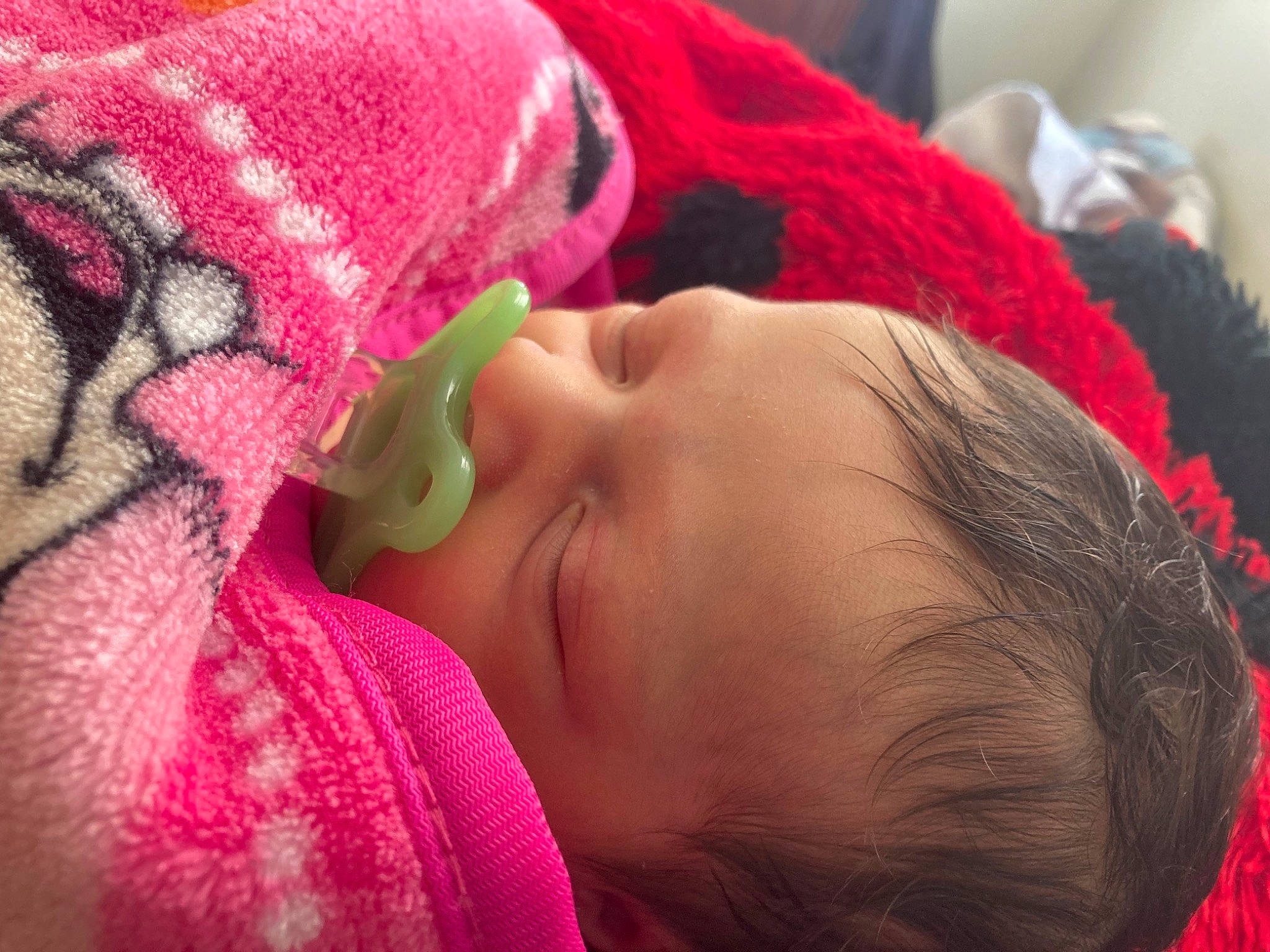 Callie is registered to the contest to win money with this photo: baby, baby_toddler_clothing, cheek, child, close_up, comfort, eye, eyelash, fun, happy, knit_cap, lip, magenta, mouth, nose, person, pink, red, skin, textile