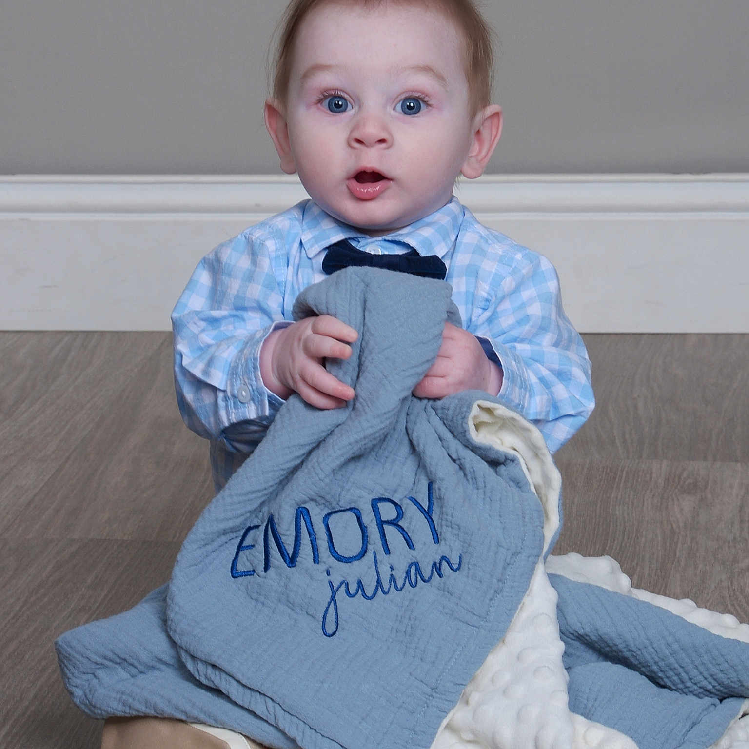 Emory joined the competition — help win amazing prizes! accessories, baby, blanket, bodypart, clothing, couch, face, finger, furniture, hand, hardwood, head, longsleeve, pants, person, photography, portrait, sitting, sleeve, wood