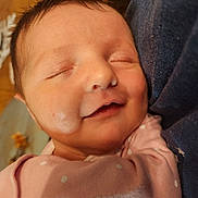 Huntlee is registered to the contest to win money with this photo: baby, infant, sleeping, smile, face, pink_clothing, polka_dot, closeup, skin, head, hair, child, newborn, peaceful, resting, soft_light, indoors, cute, portrait, baby_clothes