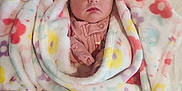 Huntlee is registered to the contest to win money with this photo: newborn, baby, blanket, sleeping, floral_pattern, soft_texture, cozy, infant, wrapped, cute, peaceful, indoors, bed, child, person, pink_clothing, resting, toddler, warm, portrait