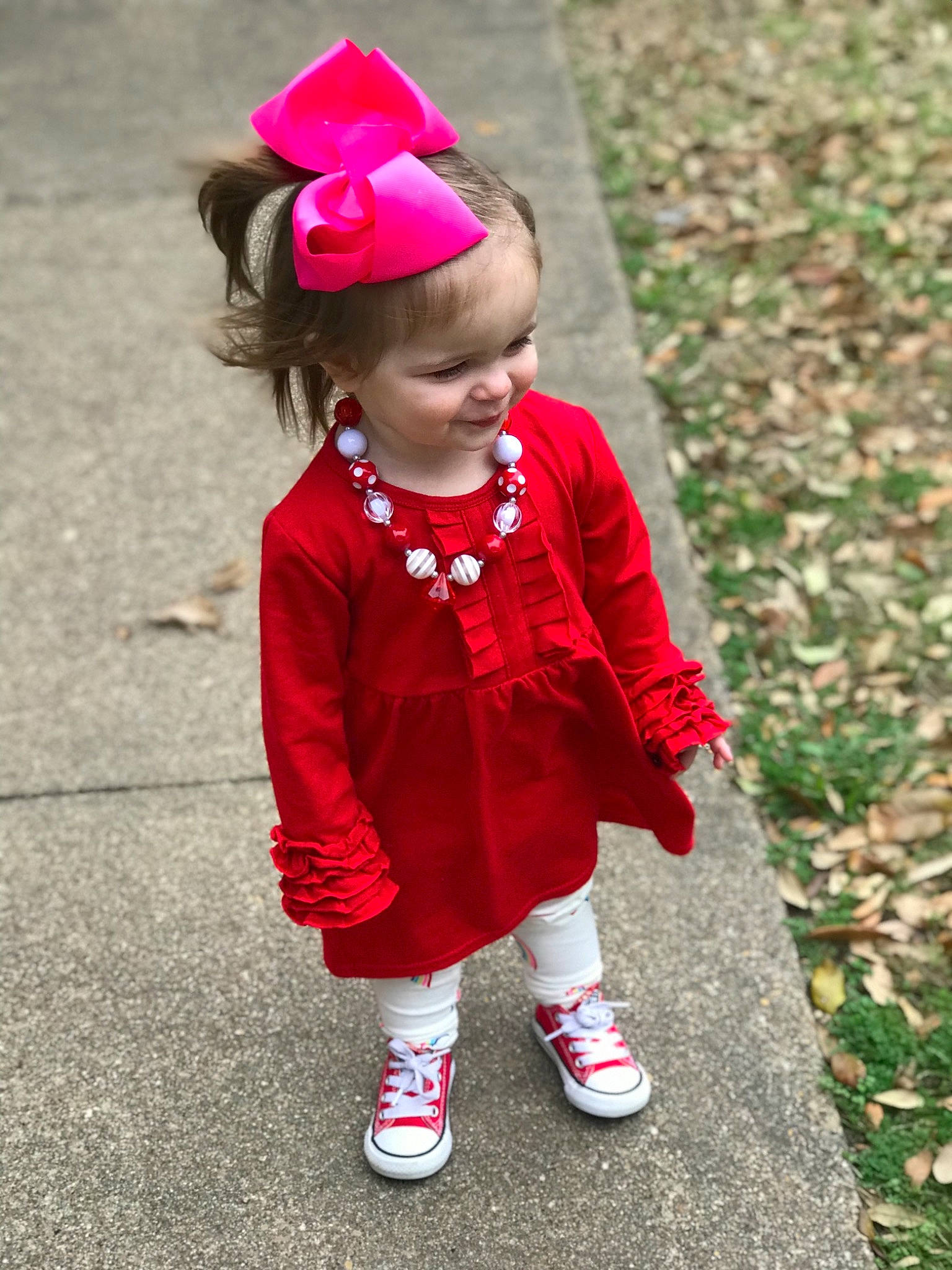 Novaleigh is registered to the contest to win money with this photo: baby, child, child_model, dress, fashion_accessory, flower, footwear, outerwear, pattern, person, pink, plant, red, shoe, sleeve, toddler