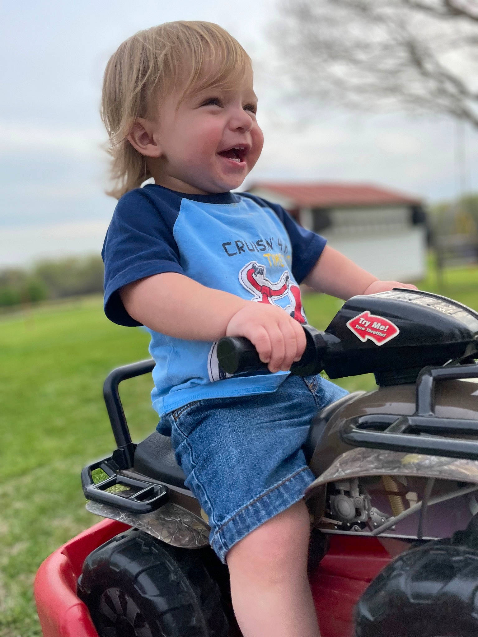 Jackson joined the competition — help win amazing prizes! automotive_lighting, automotive_tire, baby_toddler_clothing, fender, finger, grass, happy, motor_vehicle, person, photograph, riding_toy, rolling, sky, smile, t_shirt, tire, toddler, tread, tree, vehicle
