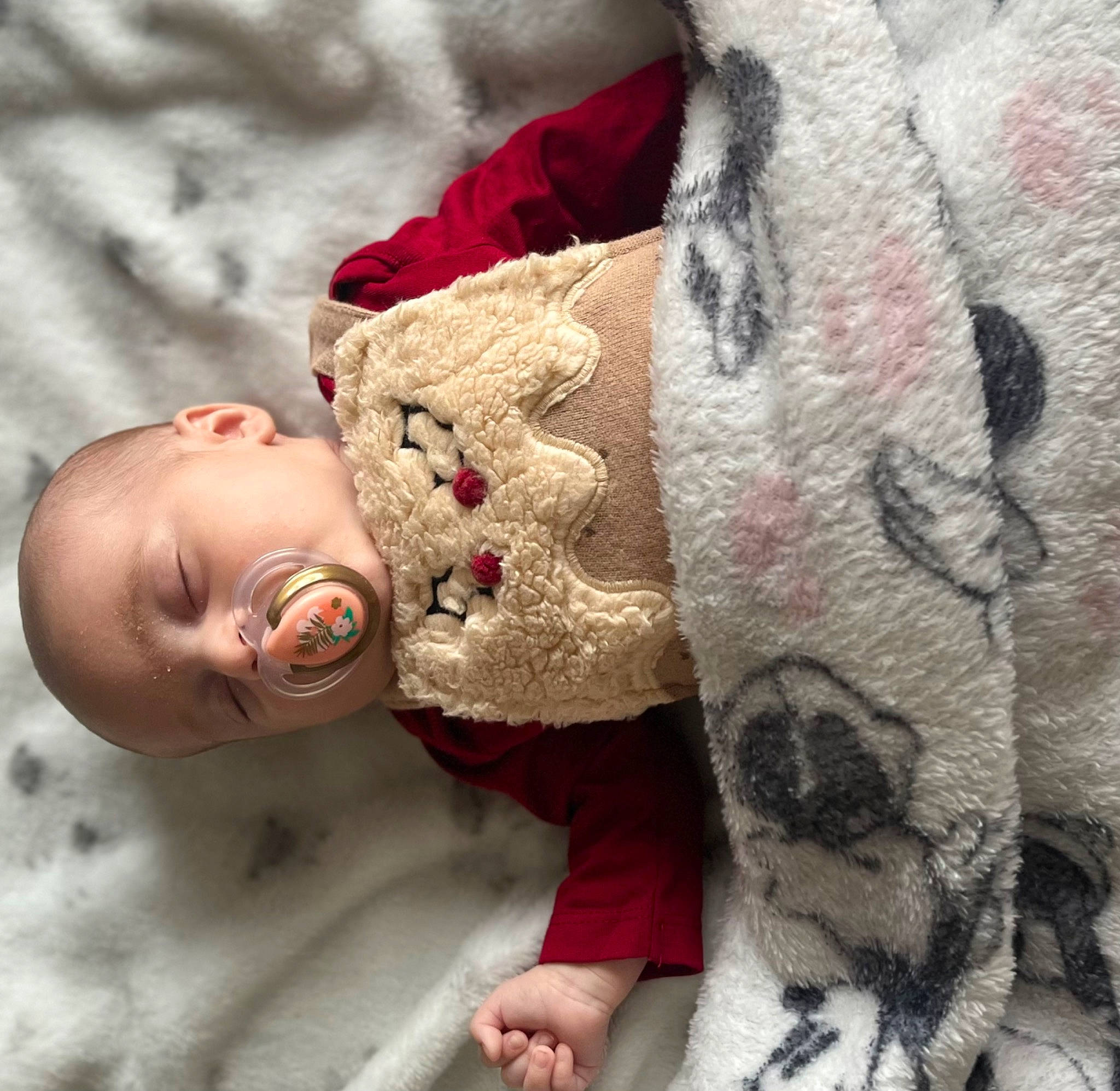 Ella is registered to the contest to win money with this photo: arm, baby, beauty, child, close_up, comfort, happy, headgear, human, human_body, linens, lip, mouth, nose, people, person, pink, skin, sleeve, textile