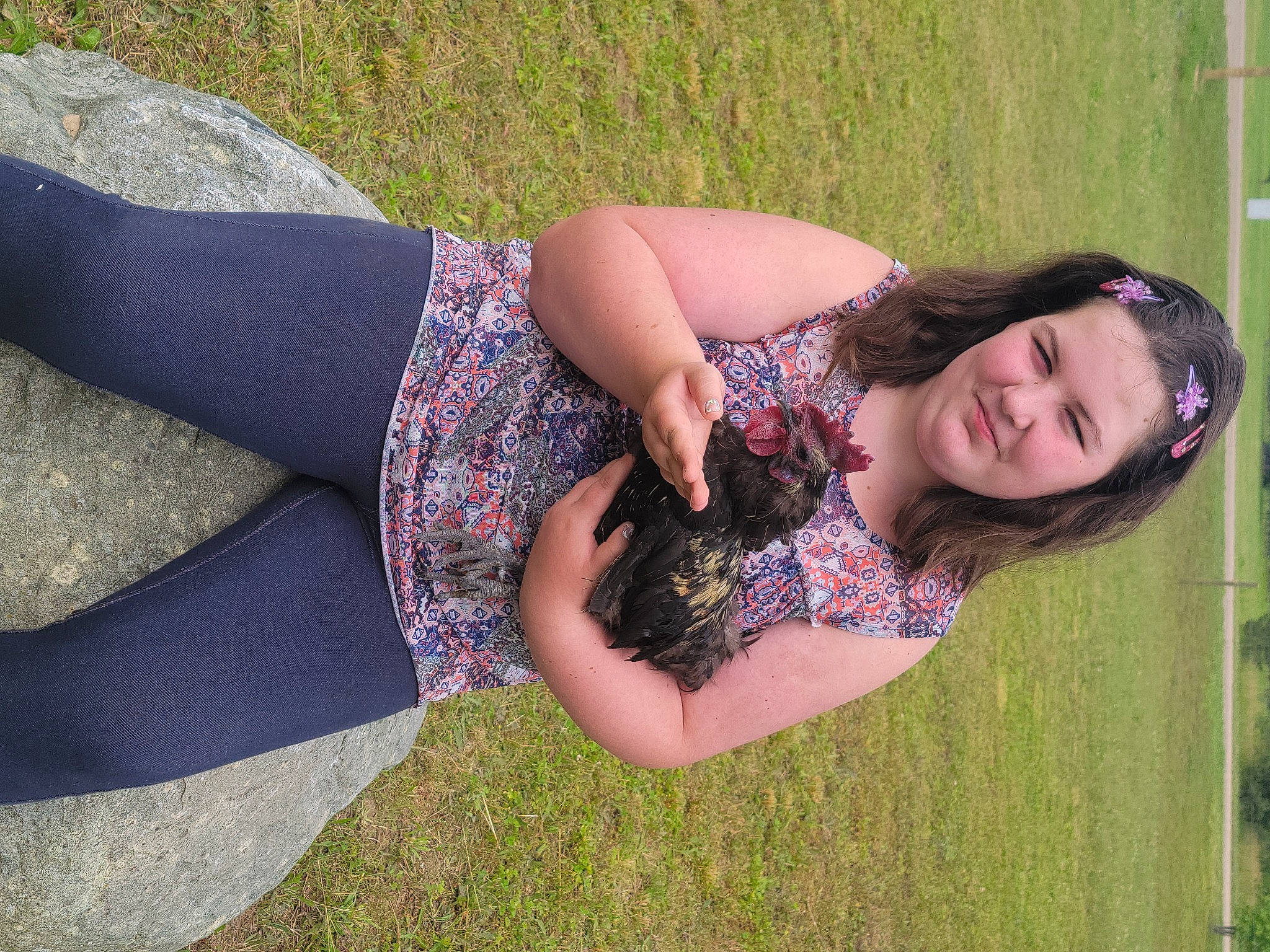 Della is registered to the contest to win money with this photo: arm, black_hair, cool, flash_photography, gesture, grass, happy, joint, joy, leisure, people_in_nature, person, plant, shoulder, smile, summer, sunlight, textile, thigh, tree