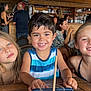 child, smiling, girl, boy, table, restaurant, indoor, wooden_interior, people, happy, casual, tank_top, swimsuit, friends, portrait, face, hair, chair, background, cafe
