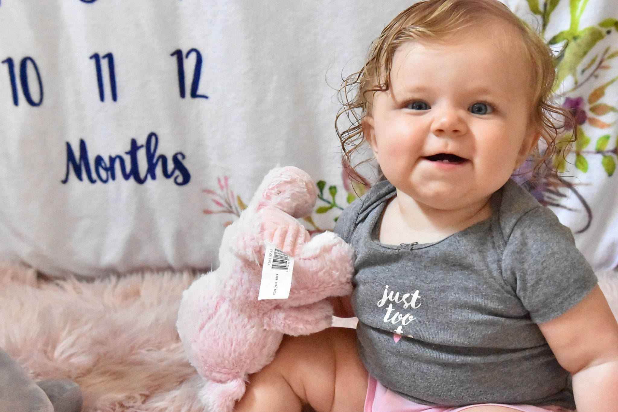 Sloane is registered to the contest to win money with this photo: baby, baby_toddler_clothing, cheek, dress, eyelash, facial_expression, finger, gesture, happy, lip, nose, people, person, pink, product, skin, sleeve, smile, thumb, toddler