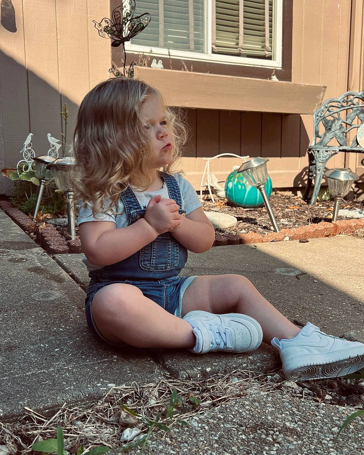 Sloane is registered to the contest to win money with this photo: baby, chair, child, flooring, fun, garden, grass, human_leg, landscape, leisure, person, plant, shoe, sitting, sneakers, soil, sunlight, thigh, toddler, vacation